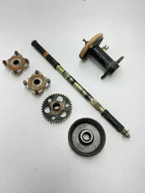 02 2002 Polaris Scrambler 90 2×4 2T OEM Rear Axle Hubs Brake Bracket Carrier